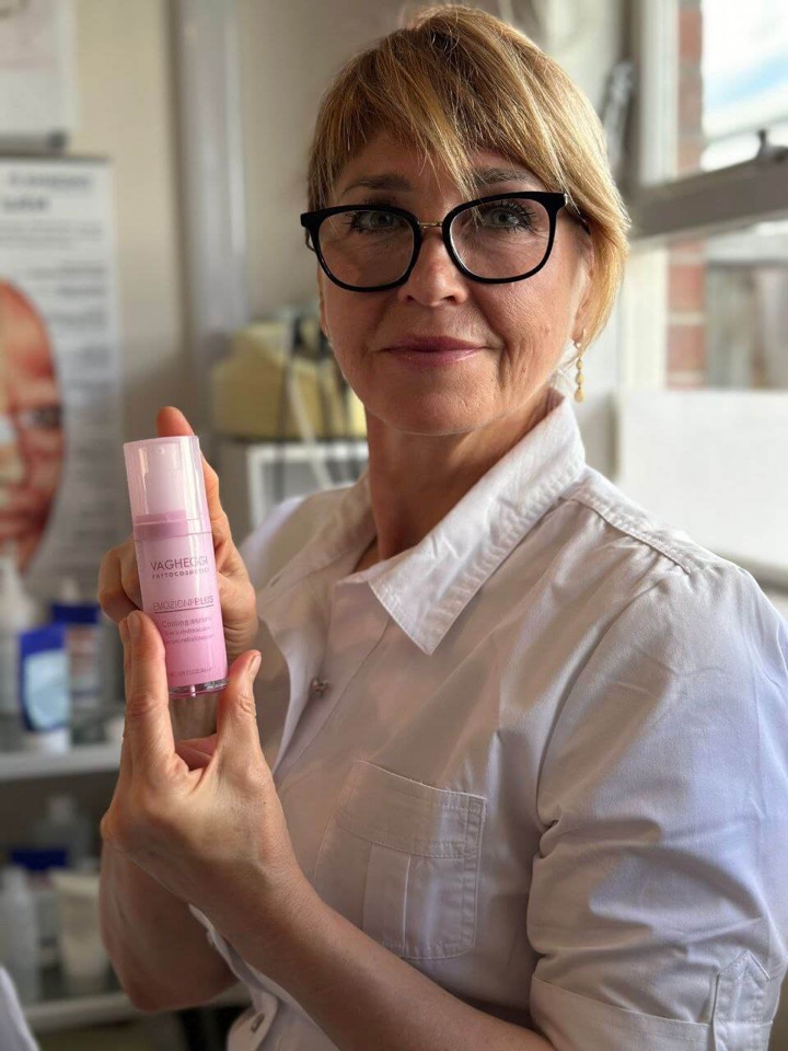 Elena Khob holding a skincare product
